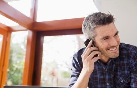 A man talking on a mobile smartphone