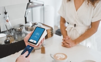 A person using a mobile payment terminal